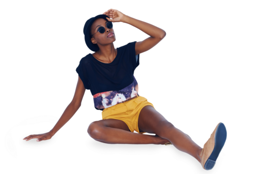Hipster, fashion or black woman on floor, smile and stylish outfit isolated on transparent background. African person, model or girl on ground with glasses, casual and png with happiness or relax