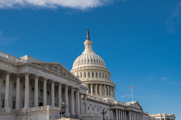 Obraz premium Washington, DC, United States Capitol Dome with bright blue sky in background.