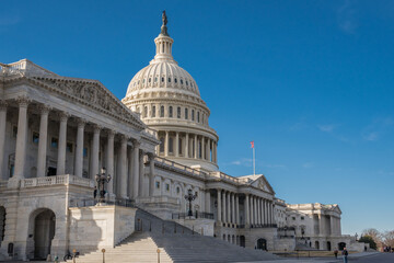 Naklejka premium Washington, DC, United States Capitol Dome with bright blue sky in background.