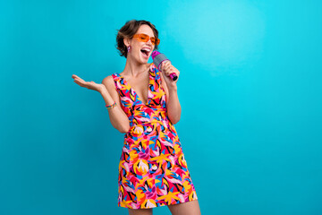 Photo of optimistic woman with bob hairdo dressed colorful clothes hold microphone sing in karaoke...