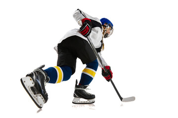 Young girl, athlete, hockey player in motion, training, playing isolated over white background. Championship. Concept of professional sport, competition, game, action and hobby