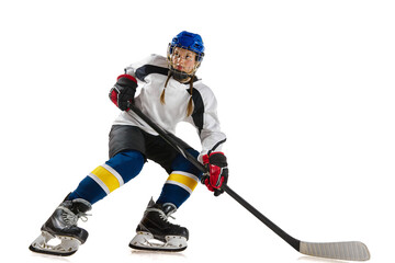 Young girl, professional hockey player in motion during game, playing isolated over white background. Achievements. Concept of professional sport, competition, game, action, hobby, success