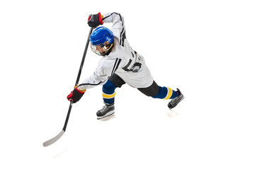 Top view image of young girl, hockey player in motion during game, training, playing isolated over white background. Concept of professional sport, competition, game, action, hobby