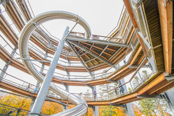 Long and curvy slide at tower of tree top path, Bad Wildbad, Black Forest, Germany, construction of steel and wood