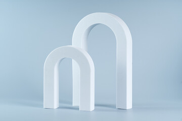Two white archs for product presentation marketing on a blue background