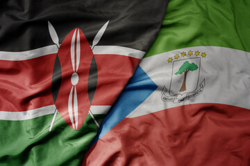 big waving national colorful flag of kenya and national flag of equatorial guinea .