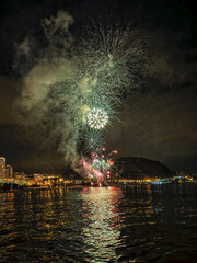  colorful fireworks in the night sky on the seafront of Alicante spain
