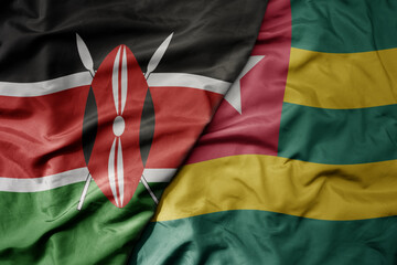 big waving national colorful flag of kenya and national flag of togo .