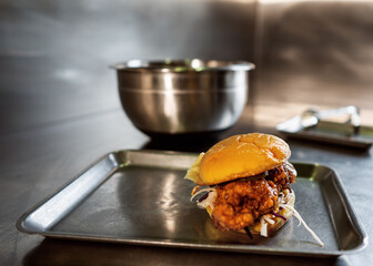 Craft juicy burger with cheese is made by a chef 