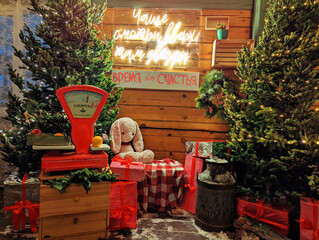 The veranda on the street is decorated for Christmas. Outdoor decor with Christmas tree and decorations.