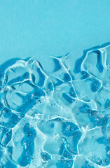 texture gel serum on blue background closeup