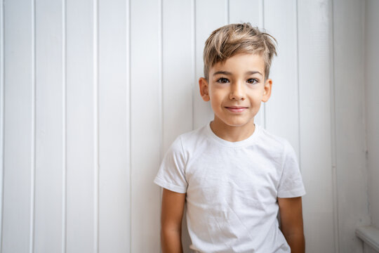 One boy caucasian child seven years old kid at home bright portrait