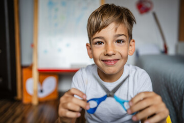 One boy caucasian child seven years old kid at home bright portrait
