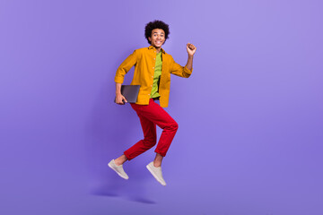 Fototapeta na wymiar Full length profile side photo of crazy nice cheerful man wear stylish clothes hurry office isolated on purple color background