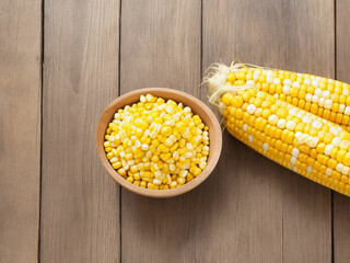 Top view fresh raw corn yellow plant on a dark-light table color green photo