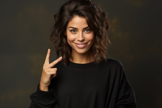 Halfhaired brunette woman making the v sign with her hand and fingers