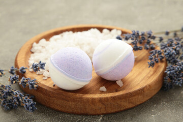 Natural cosmetics. Handmade lavender bath bombs and lavender flowers on wooden board.