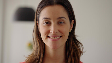 Portrait of caucasian woman, beautiful young human face with white skin, serious look at camera open and confident. Girl wide smiling with healthy white teeth.  
