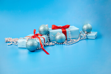 christmas gift box with ribbon, balls and beads