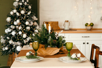 The table is decorated for Christmas with festive decor