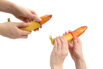 Woman put on a condom on a banana. Isolated on white background.