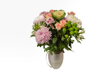 Bouquet of flowers with pink roses, brassica flower, chrysanthemum and freesia flower in a vase.