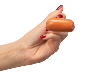 Small sausage on a fork in woman hand isolated.