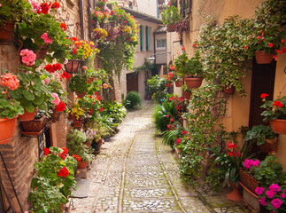 Fototapeta na wymiar Italia, Umbria, il paese di Spello, una strada fiorita.