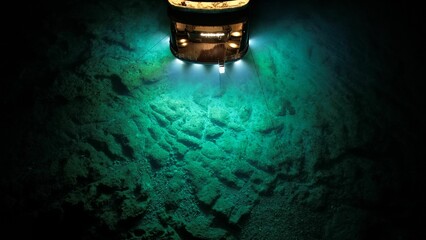 High-powered lamp illuminating a deep underwater exploration scene - obrazy, fototapety, plakaty