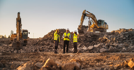 Construction Site With Excavators on Sunny Day: Diverse Team Of Male And Female Specialists...