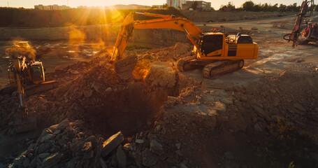 Aerial Drone Shot Of Construction Site On Sunny Day: Industrial Excavators Digging Rocks To Lay...
