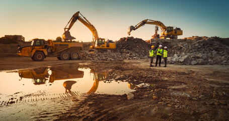 Aerial Drone Shot Of Construction Site With Heavy Machinery On Sunny Day: Diverse Team of Real...