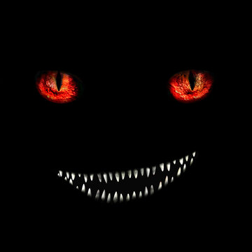 cheerful monster with red eyes and bared mouth