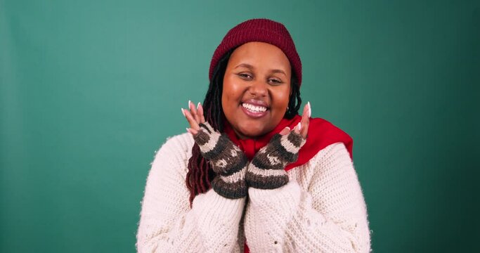 Excited young woman squeals with hands under chin, Cozy winter Christmas studio