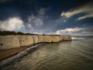 Scenic view of Kingsgate Bay on a gloomy cloudy day. Kent, England