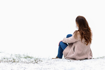 Young woman on the background of winter ladscape.