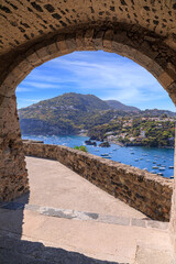 Glimpse of Ischia Island in Italy from Aragonese Castle: Cartaromana beach in the distance. - obrazy, fototapety, plakaty