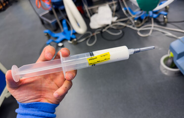 medical syringes with anesthetic drugs in hospital setting, illustrating healthcare, medication, and treatment concept