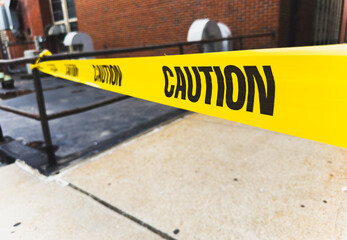 Bright caution yellow line sign marking safety zone, symbolic warning for potential hazards, isolated on white