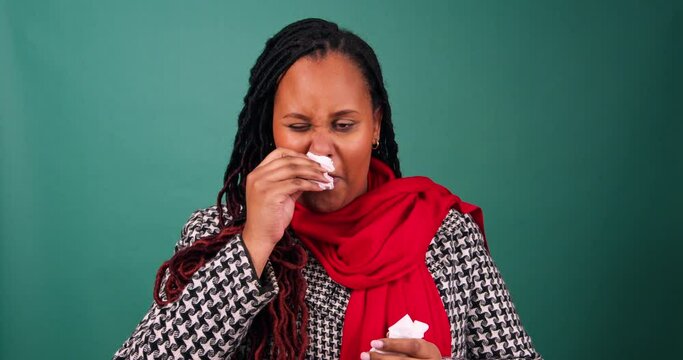 Sick woman wipes nose with tissue, cold and flu over Christmas festive season