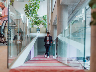 In a sleek corporate setting, the young and charismatic director strides confidently down the...