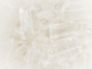 White Transparent crystals on White background. Fresh cool ice cube background