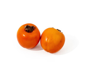 Ripe orange persimmon fruits isolated on a white background. Persimmons on white.