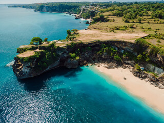 Aerial view of Balangan beach with rock and turquoise ocean in Bali.