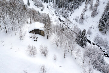 Typical mountain hut of Val Tartano in Valtellina, Italy, in winter landscape - 679283491