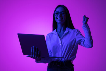 Photo of woman hold pc support cybersport team isolated neon gradient color background