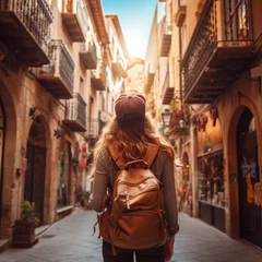 Deurstickers Traveler girl in street of old town in Spain. Young backpacker tourist in solo travel. Vacation, holiday, trip © Lens_Lore
