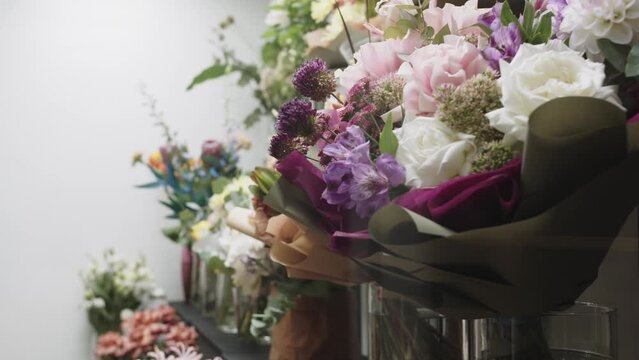A Colorful Display of Blooming Flowers on a Shelf in a Vibrant Flower Shop