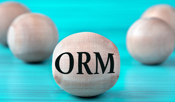 The letters ORM are depicted on a wooden round ball on a blue background