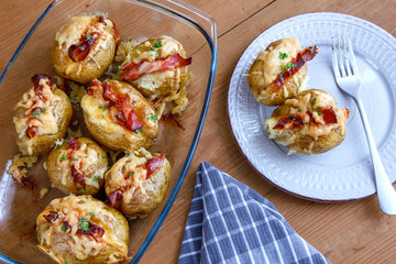 Baked potatoes with bacon and mozzarella